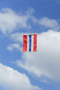 Low angle view of flag against sky