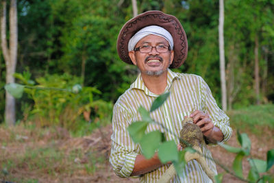 Portrait of man standing outdoors