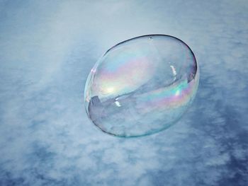 Close-up of bubbles against sky