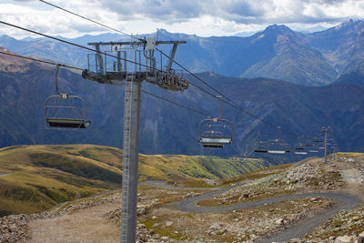 Cable car with open seats in the mountains in summer. ski lift in the caucasus in georgia. 