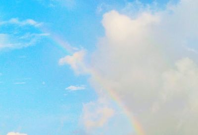 Low angle view of rainbow in sky