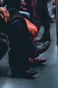 Low section of people sitting outdoors