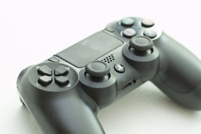 Close-up of camera over white background