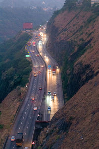 High angle view of traffic on road near a cliff