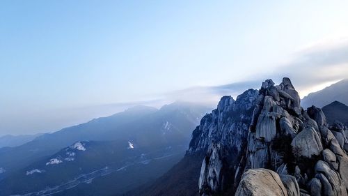 Scenic view of mountains against sky during winter