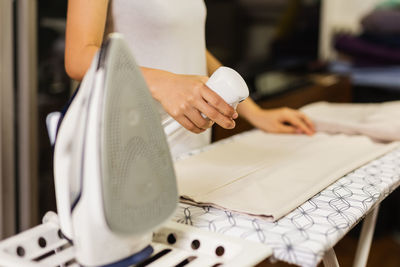 Housewife spray foggy for iron clothes on ironing board