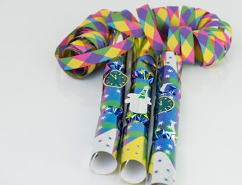 Close-up of colorful paper over white background