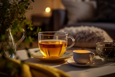Hot mug tea. a glass of tea with decorative dishes.
