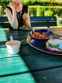 Midsection of woman eating food