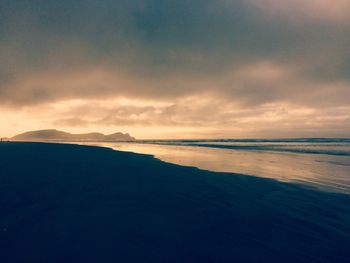 Scenic view of sea against sky at sunset