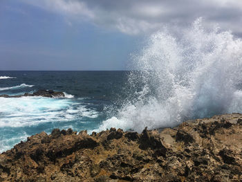 Waves splashing on rocks