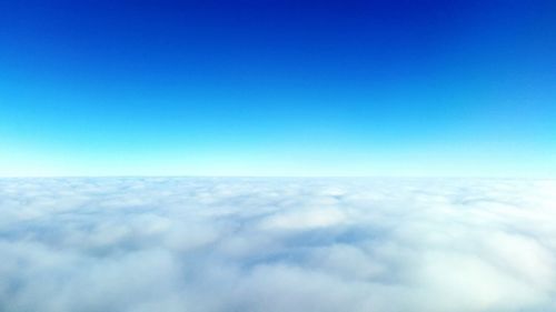 Scenic view of landscape against blue sky