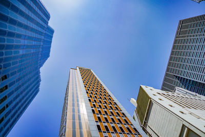 Low angle view of modern buildings against sky