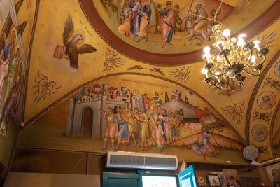 Low angle view of graffiti on ceiling of building