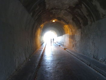 Rear view of man in tunnel