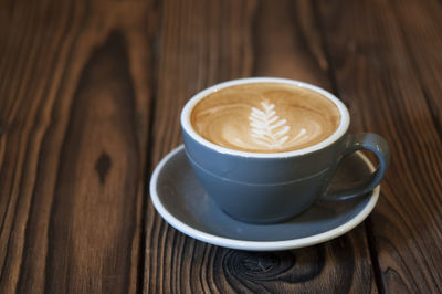 Close-up of cappuccino on table