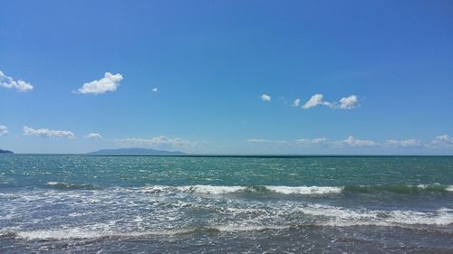 Scenic view of sea against blue sky