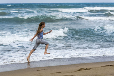 Full length of boy on beach