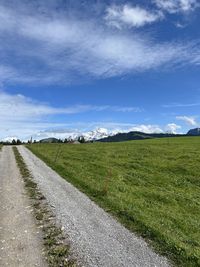 Scenic view of agricultural field against sky