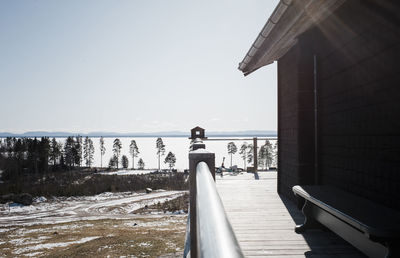 Bird house on a balcony of a house over looking the sea