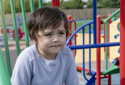 Close-up of cute boy playing in playground