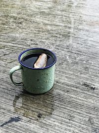 Close-up of drink on wet table