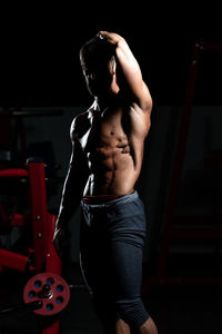 Rear view of man exercising in gym