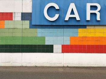 Car text on colorful wall