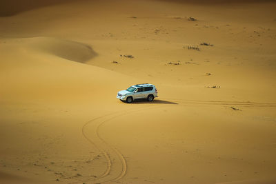 Toy car on sand at desert