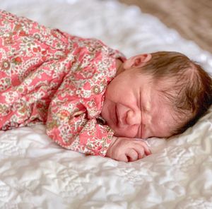 Cute baby sleeping on bed