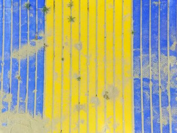Full frame shot of yellow and blue wooden wall