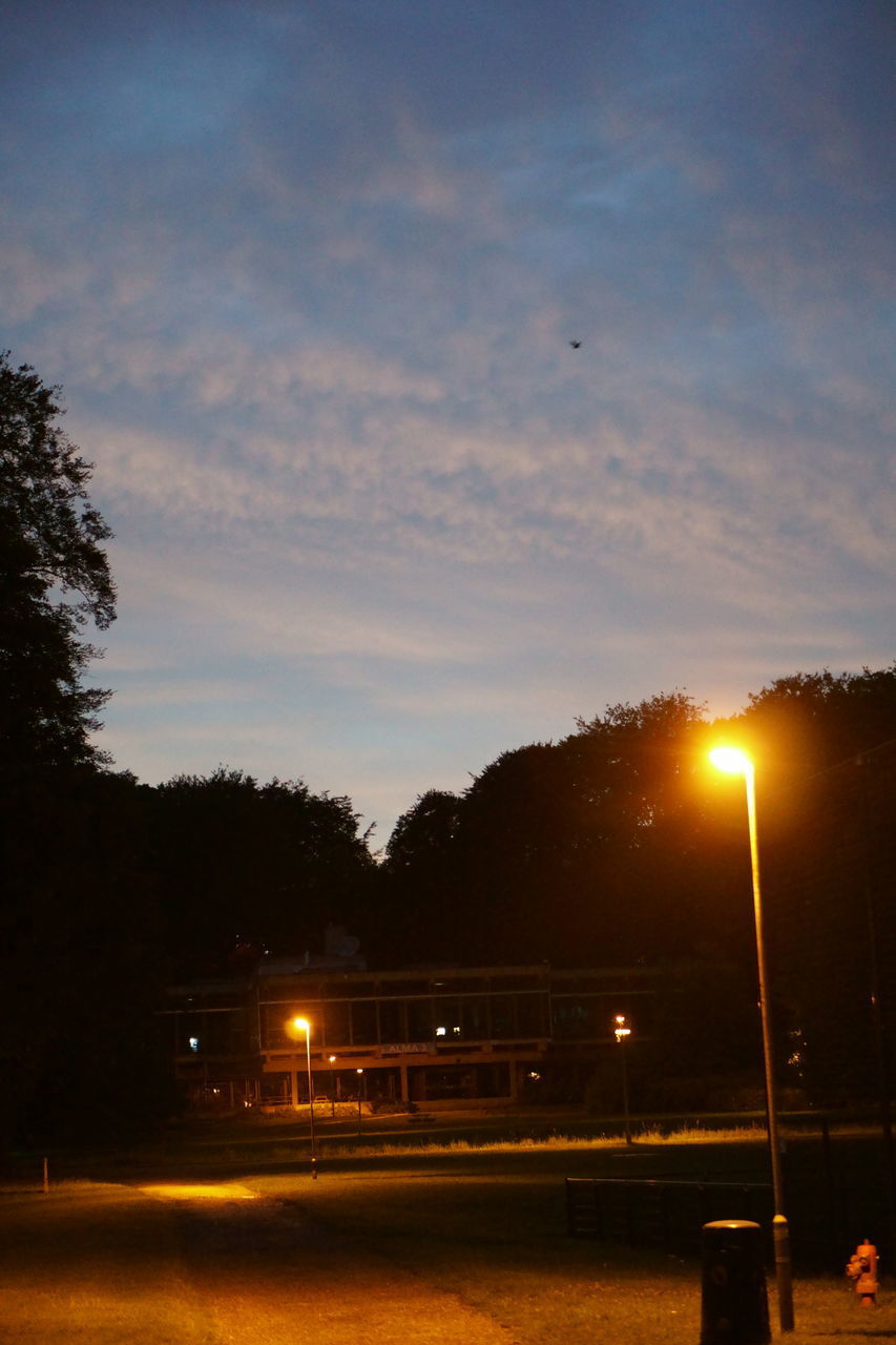 ILLUMINATED STREET LIGHTS AT NIGHT