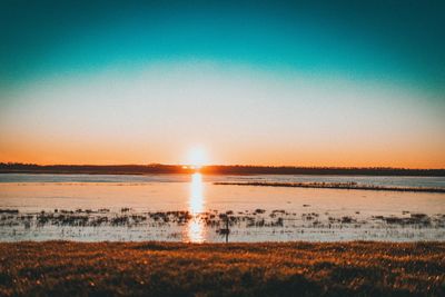 Scenic view of landscape against sky during sunset