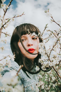 Portrait of a beautiful young woman outdoors