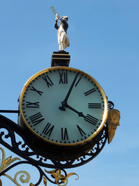 Low angle view of statue against sky