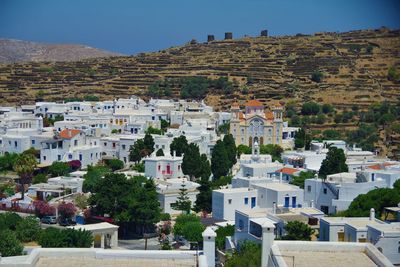 Houses in town against clear sky