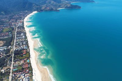 High angle view of sea and buildings