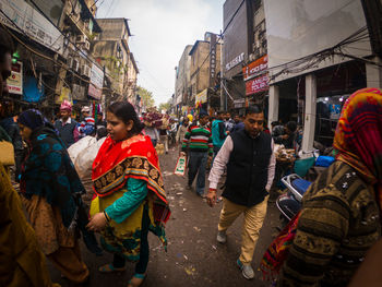 People walking on street in city