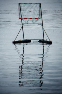 Volleyball goal at wet beach