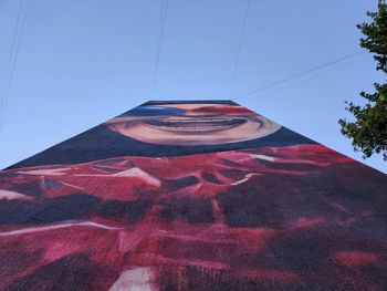 Low angle view of building against blue sky