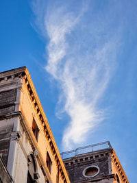 Low angle view of historical building against blue sky