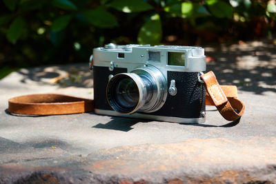 Close-up of camera on table