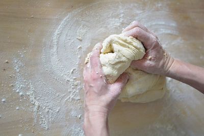 Close-up of person preparing food on table