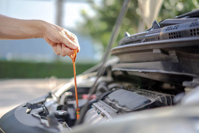 Close-up of hand holding car