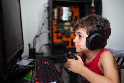 Portrait of boy playing with toy