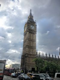 Low angle view of historic building against cloudy sky