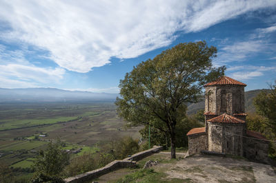 Scenic view of landscape against cloudy sky