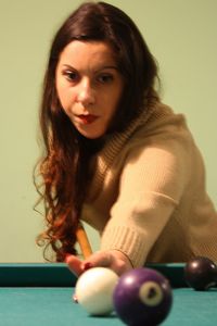 Portrait of young woman playing with ball