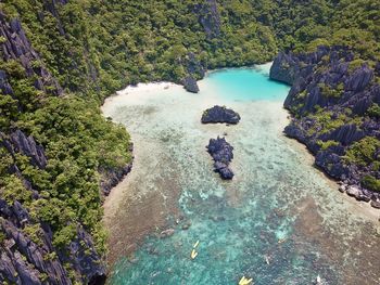 High angle view of water flowing through rocks