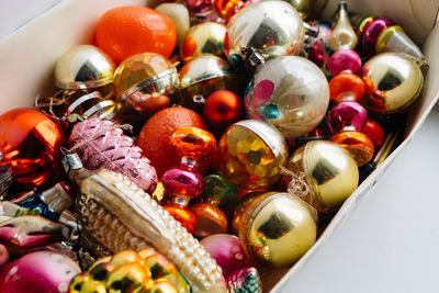 High angle view of christmas ornaments in box